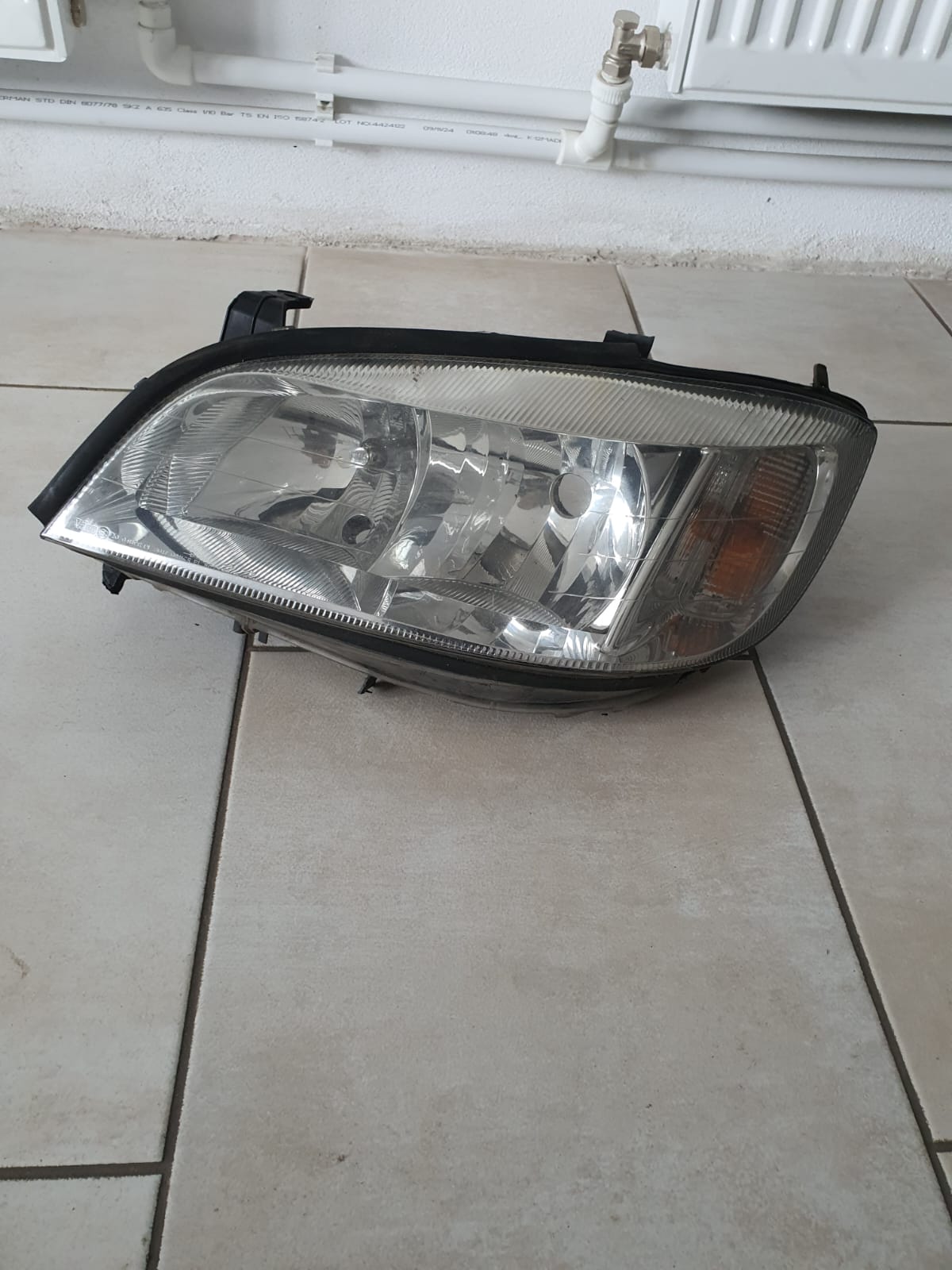 FAR STANGA CU DEFECT SE VEDE IN POZE OPEL ZAFIRA A COD 89100054 FACTURA SI GARANTIE